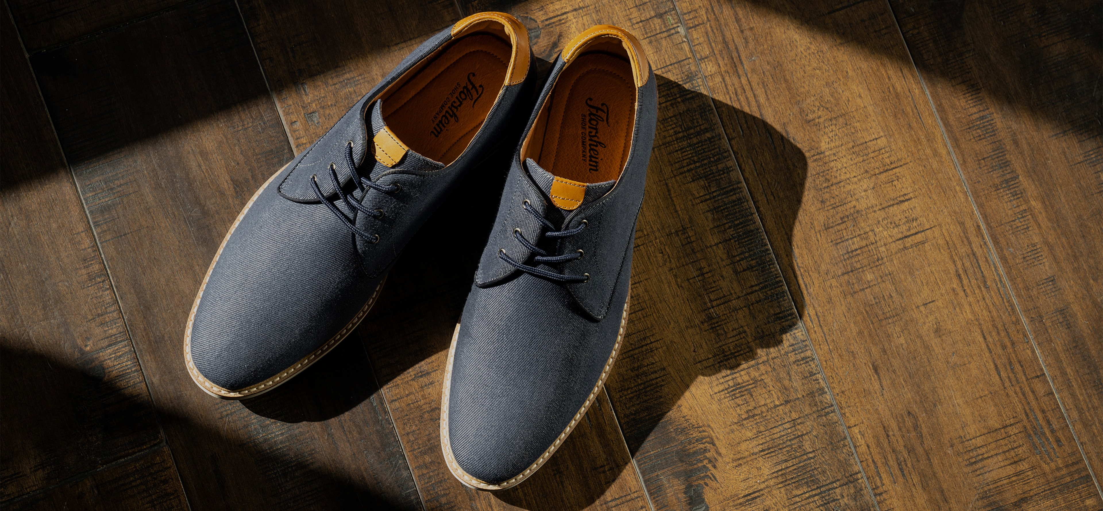 The featured shoe in this image is the Highland Canvas Plain Toe Oxford in Navy.
