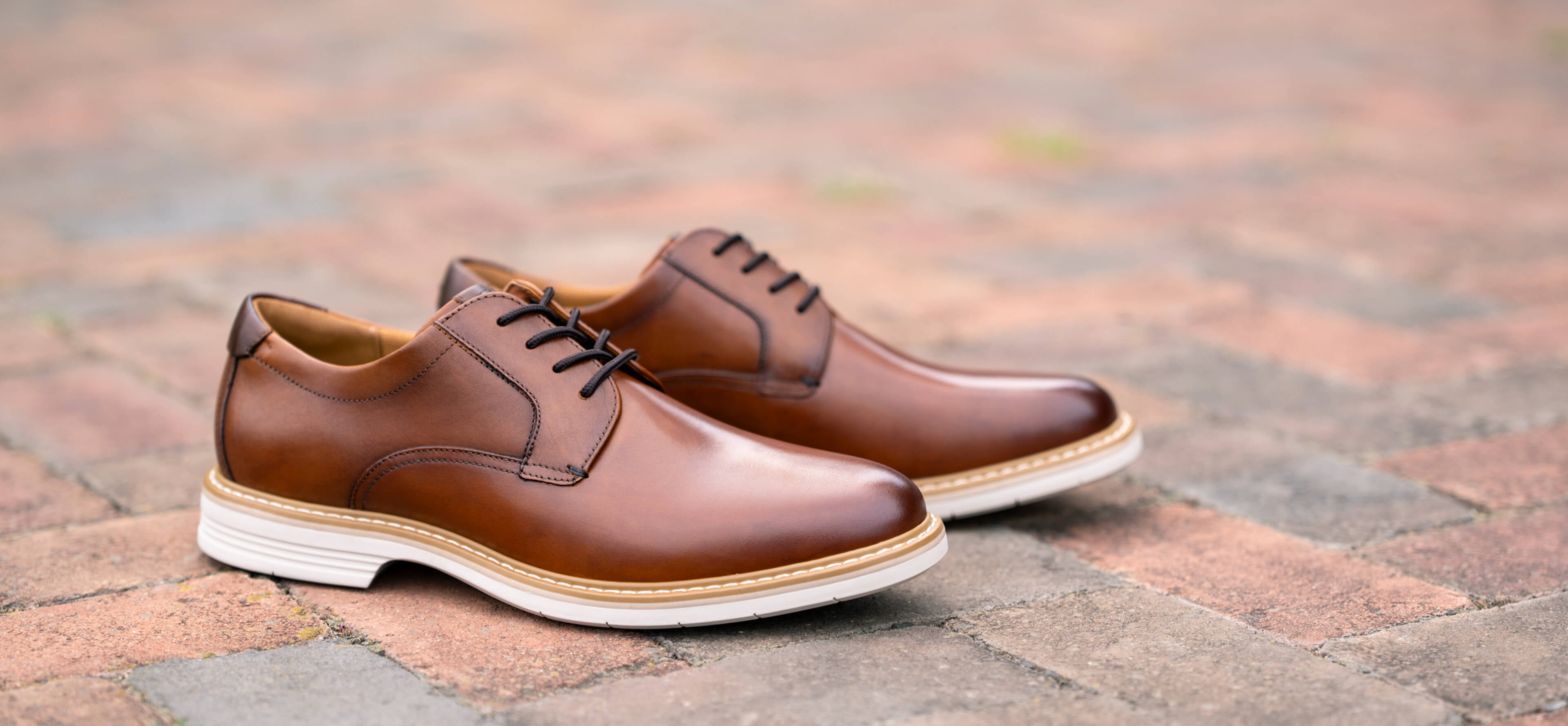 Image features the Florsheim Norwalk Plain Toe Oxford in cognac.